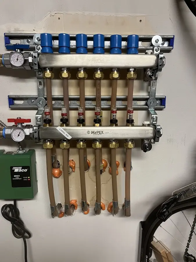 Plumber performing Water Heater Repair at a residential property in Laurel